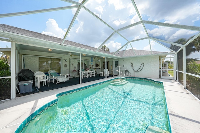 4055 Alwick Ln, North Port, FL 34287 - outdoor pool with a ceiling fan, a patio area, and glass enclosure