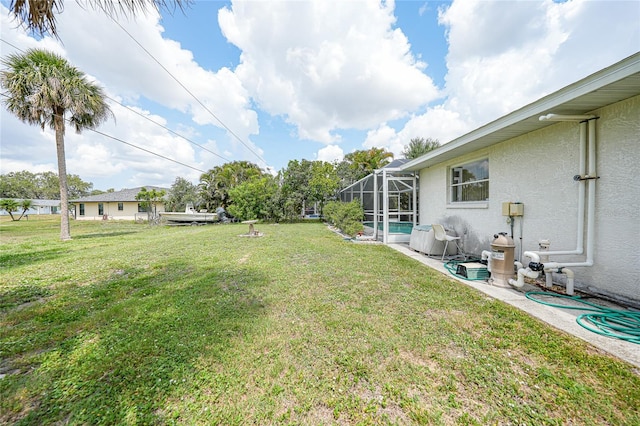 4055 Alwick Ln, North Port, FL 34287 - view of green lawn with glass enclosure and a pool