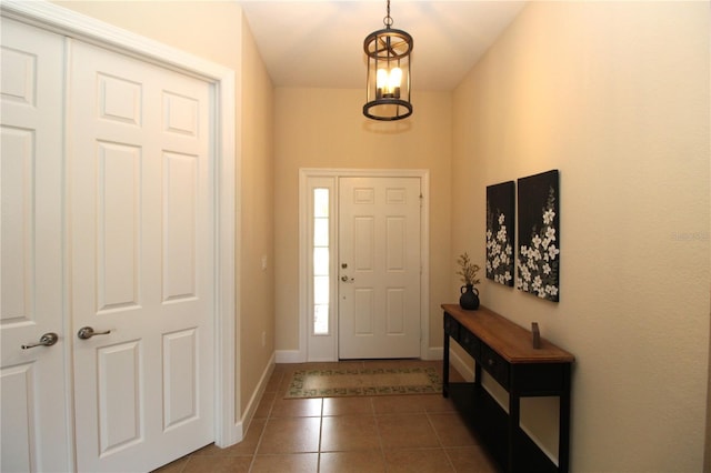 13256 Creekside Ln, Port Charlotte, FL 33953 - foyer entrance with dark tile patterned flooring and baseboards