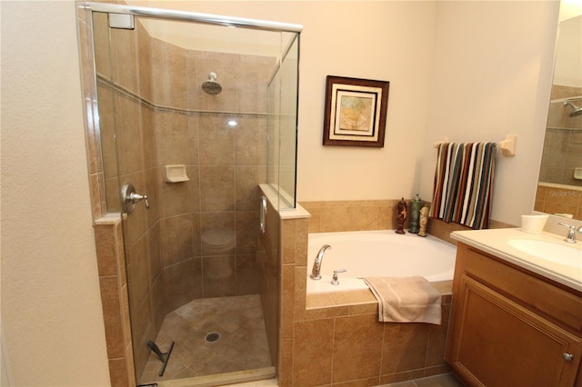 13256 Creekside Ln, Port Charlotte, FL 33953 - full bathroom featuring vanity, a shower stall, and a garden tub