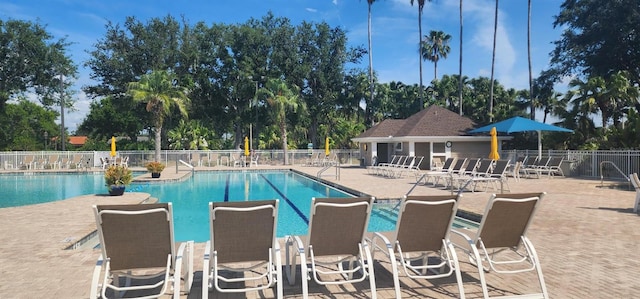 13256 Creekside Ln, Port Charlotte, FL 33953 - community pool with a patio area and view of wooded area