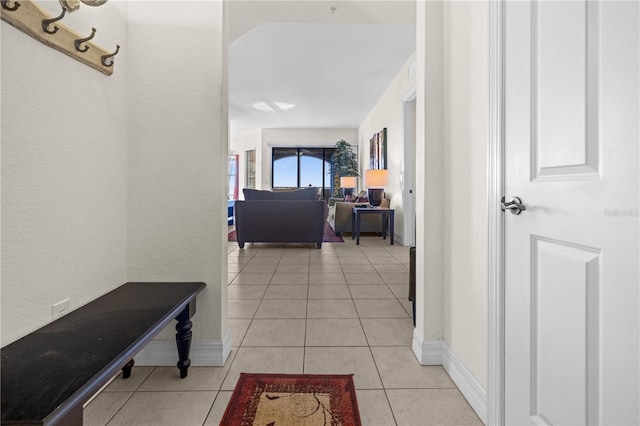 99 Vivante Blvd Unit 303, Punta Gorda, FL 33950 - hall with light tile patterned floors and baseboards