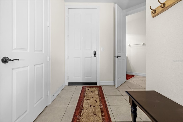 99 Vivante Blvd Unit 303, Punta Gorda, FL 33950 - doorway to outside featuring light tile patterned flooring and baseboards