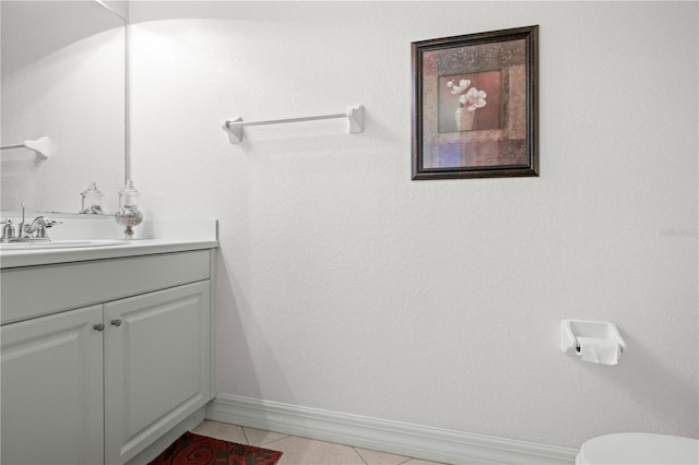 99 Vivante Blvd Unit 303, Punta Gorda, FL 33950 - bathroom with baseboards, vanity, tile patterned floors, and toilet