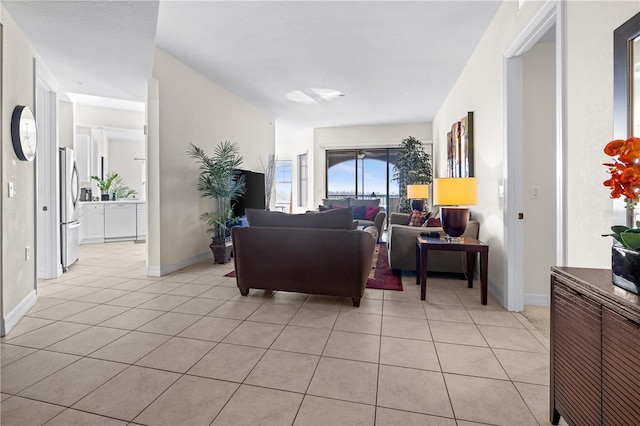 99 Vivante Blvd Unit 303, Punta Gorda, FL 33950 - living area featuring light tile patterned flooring and baseboards