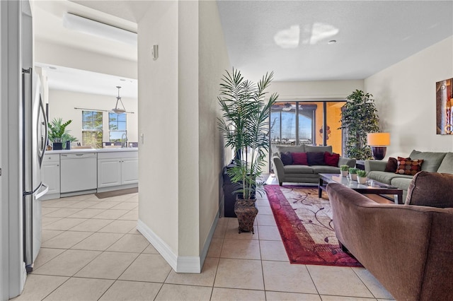 99 Vivante Blvd Unit 303, Punta Gorda, FL 33950 - living area with light tile patterned floors and baseboards
