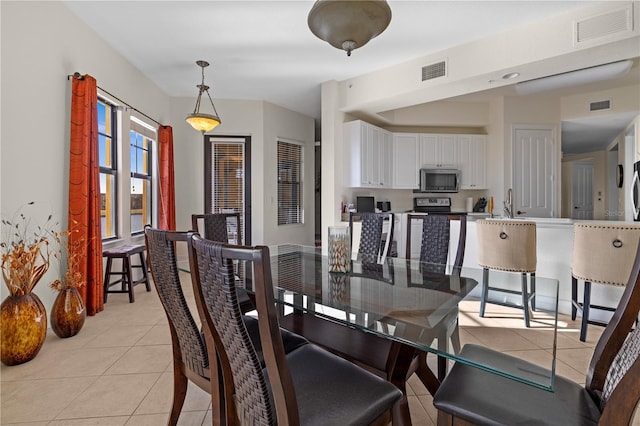 99 Vivante Blvd Unit 303, Punta Gorda, FL 33950 - dining space featuring light tile patterned floors