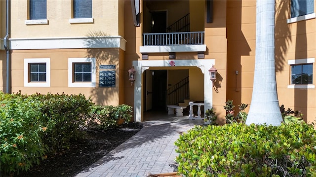 99 Vivante Blvd Unit 303, Punta Gorda, FL 33950 - entrance to property with stucco siding and a balcony