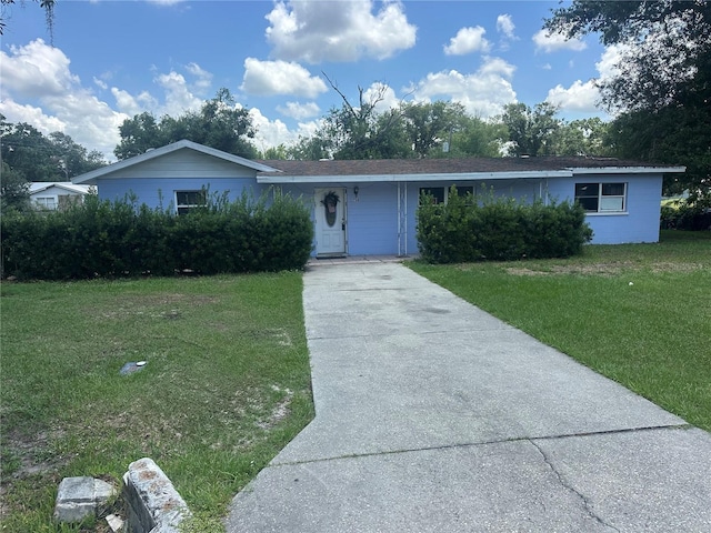 708 N Johnson Ave, Arcadia, FL 34266 - single story home featuring concrete driveway and a front yard