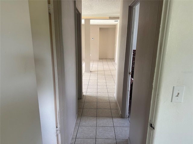 708 N Johnson Ave, Arcadia, FL 34266 - hall with light tile patterned floors and a textured ceiling