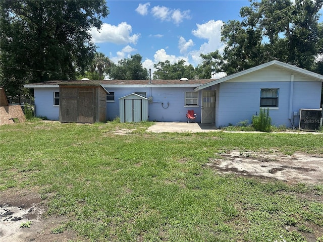 708 N Johnson Ave, Arcadia, FL 34266 - rear view of property with a patio area, a yard, and cooling unit