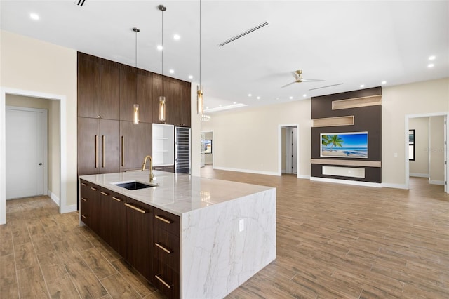 3413 NW 9th Ter, Cape Coral, FL 33904 - kitchen with modern cabinets, a sink, a large island with sink, ceiling fan, and recessed lighting