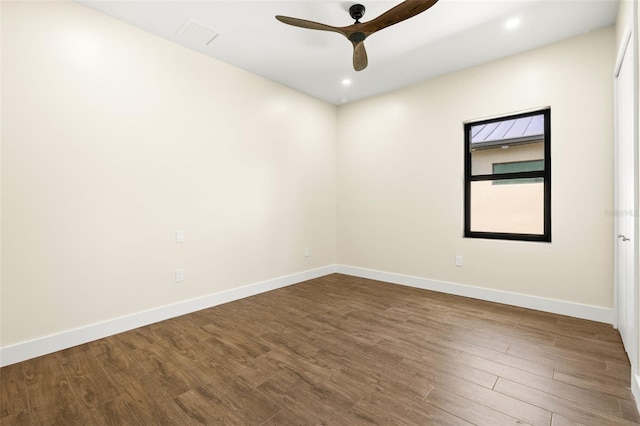3413 NW 9th Ter, Cape Coral, FL 33904 - empty room with dark wood-style floors, ceiling fan, baseboards, and recessed lighting