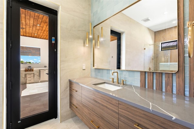 3413 NW 9th Ter, Cape Coral, FL 33904 - bathroom featuring vanity and decorative backsplash