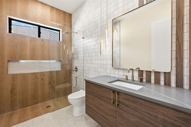 3413 NW 9th Ter, Cape Coral, FL 33904 - bathroom with tile walls, toilet, walk in shower, vanity, and tile patterned floors