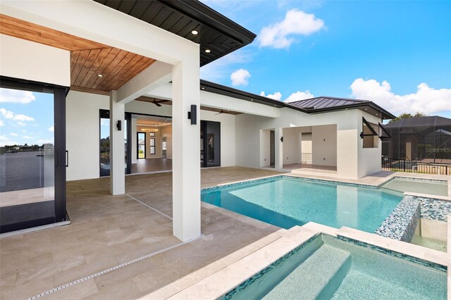3413 NW 9th Ter, Cape Coral, FL 33904 - view of pool featuring ceiling fan, a pool with connected hot tub, and a patio
