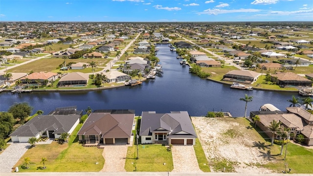3413 NW 9th Ter, Cape Coral, FL 33904 - aerial perspective of suburban area featuring a nearby body of water