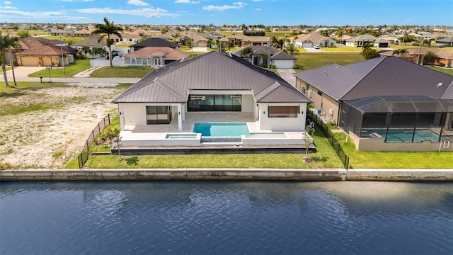 3413 NW 9th Ter, Cape Coral, FL 33904 - rear view of house with a residential view, a water view, and an outdoor pool