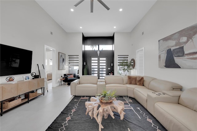 1324 Longwood Dr, Fort Myers, FL 33919 - living area featuring a towering ceiling, a ceiling fan, recessed lighting, and concrete floors