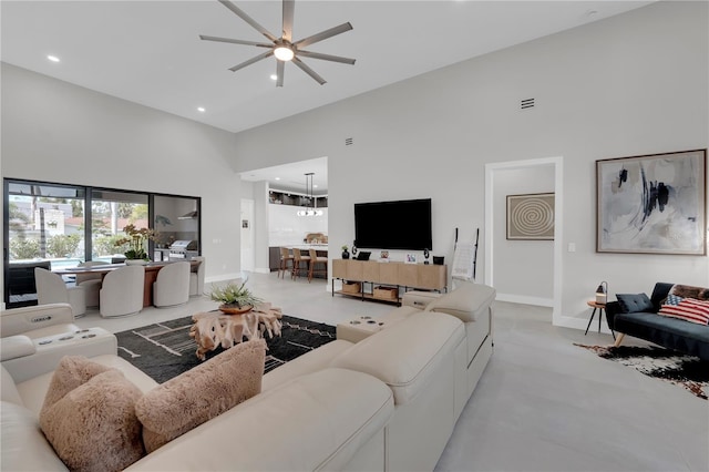 1324 Longwood Dr, Fort Myers, FL 33919 - living room with a high ceiling, ceiling fan, recessed lighting, and baseboards
