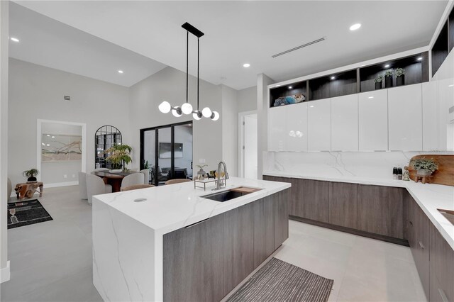 1324 Longwood Dr, Fort Myers, FL 33919 - kitchen with a sink, modern cabinets, open shelves, light stone countertops, and recessed lighting