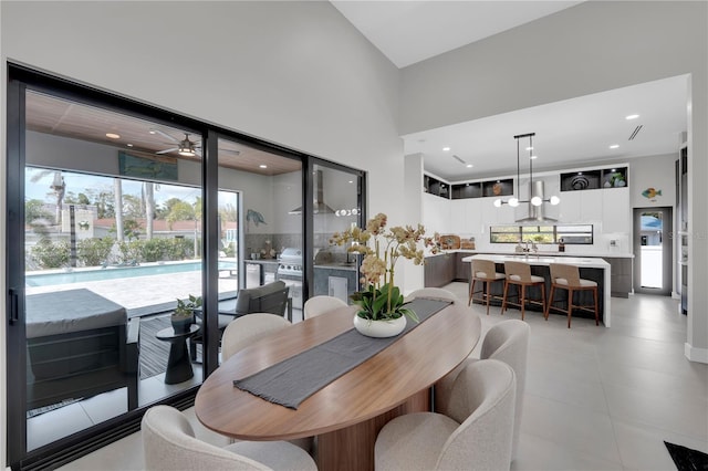 1324 Longwood Dr, Fort Myers, FL 33919 - dining room featuring a towering ceiling, plenty of natural light, a ceiling fan, and light tile patterned floors