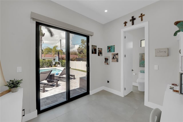 1324 Longwood Dr, Fort Myers, FL 33919 - doorway featuring baseboards, recessed lighting, and light tile patterned flooring