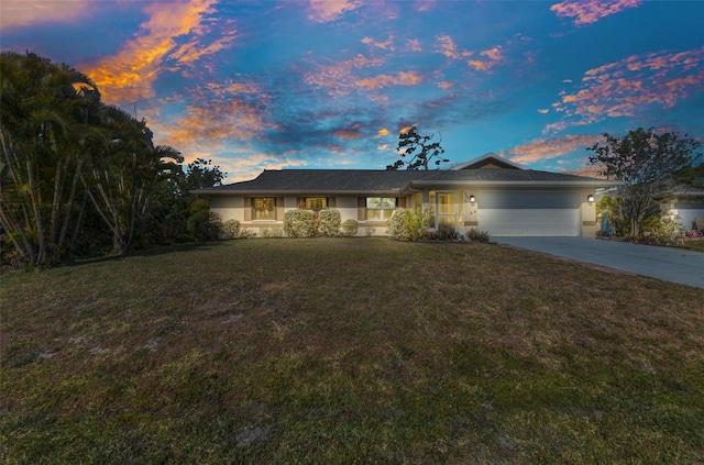 566 Reading St NW, Port Charlotte, FL 33952 - ranch-style house featuring a garage, concrete driveway, a yard, and stucco siding