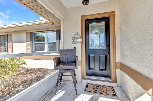 566 Reading St NW, Port Charlotte, FL 33952 - doorway to property featuring stucco siding
