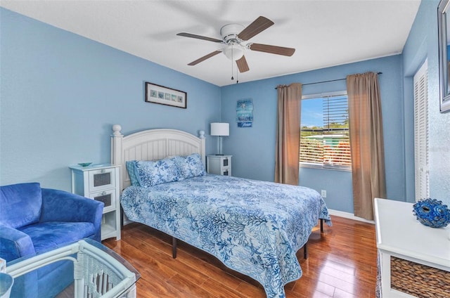 566 Reading St NW, Port Charlotte, FL 33952 - bedroom featuring wood finished floors, baseboards, and ceiling fan