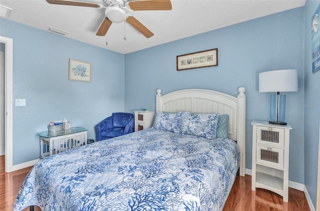 566 Reading St NW, Port Charlotte, FL 33952 - bedroom featuring wood finished floors, baseboards, and ceiling fan