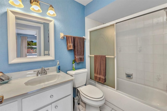 566 Reading St NW, Port Charlotte, FL 33952 - full bath featuring vanity, toilet, a textured wall, and shower / bath combination with glass door