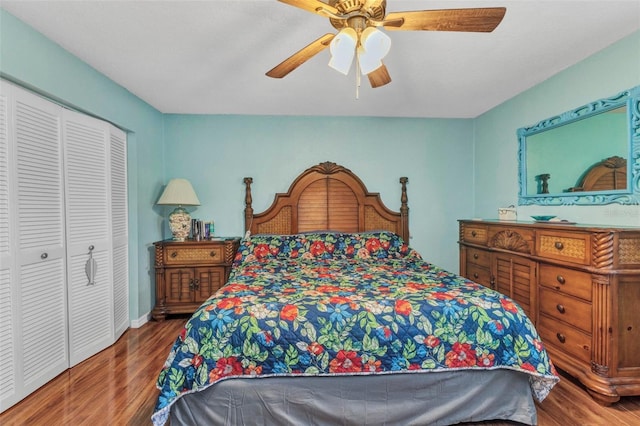 566 Reading St NW, Port Charlotte, FL 33952 - bedroom with wood finished floors, a closet, and ceiling fan