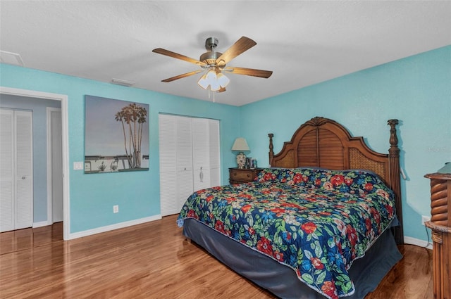 566 Reading St NW, Port Charlotte, FL 33952 - bedroom featuring baseboards, wood finished floors, a closet, and ceiling fan