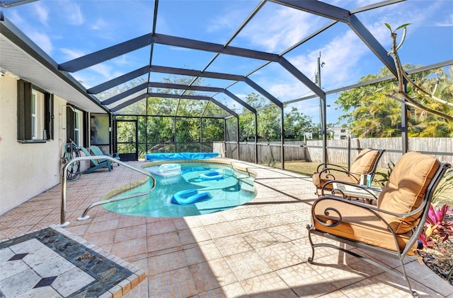 566 Reading St NW, Port Charlotte, FL 33952 - view of swimming pool with a patio, a fenced backyard, and a lanai