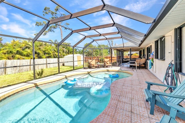 566 Reading St NW, Port Charlotte, FL 33952 - view of pool featuring a fenced backyard, a patio area, and glass enclosure