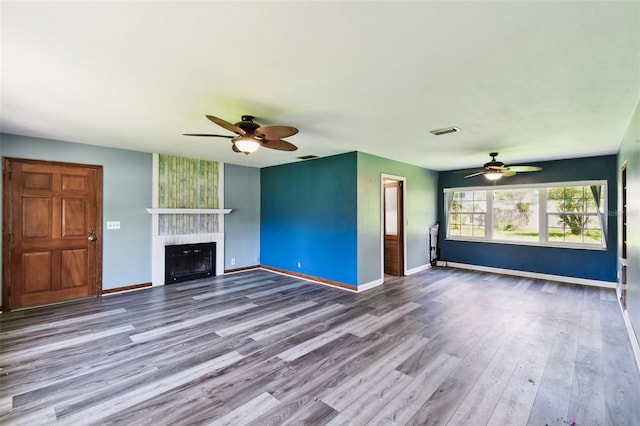 4707 Southgate Dr, Jacksonville, FL 32207 - unfurnished living room featuring a ceiling fan, wood finished floors, and baseboards