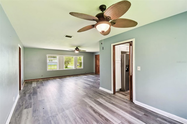 4707 Southgate Dr, Jacksonville, FL 32207 - unfurnished room with wood finished floors, baseboards, and ceiling fan