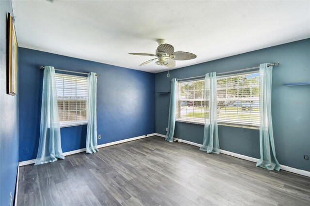 4707 Southgate Dr, Jacksonville, FL 32207 - unfurnished room with ceiling fan, wood finished floors, and baseboards