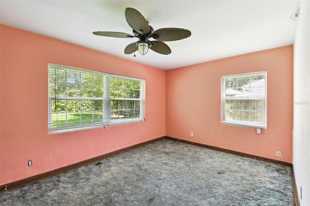 4707 Southgate Dr, Jacksonville, FL 32207 - empty room featuring plenty of natural light, carpet flooring, and ceiling fan