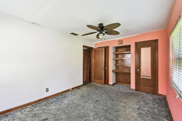 4707 Southgate Dr, Jacksonville, FL 32207 - unfurnished bedroom with carpet floors, baseboards, and multiple windows