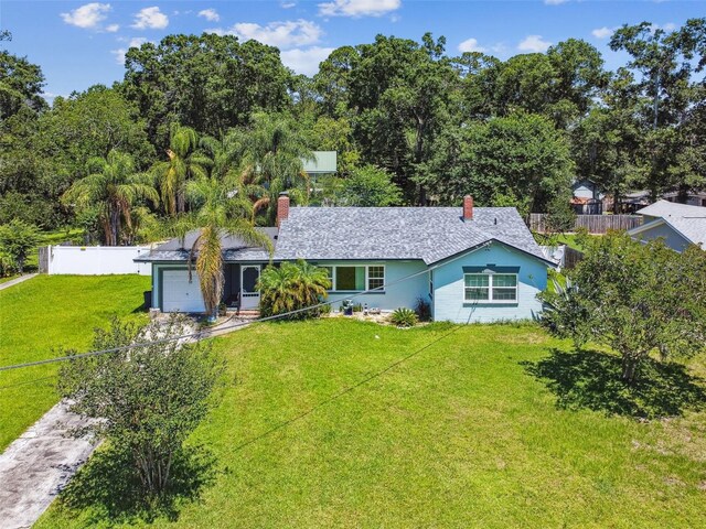 4707 Southgate Dr, Jacksonville, FL 32207 - ranch-style home with a chimney, a garage, and driveway