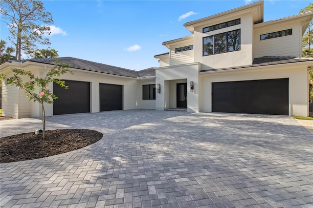 3632 Golden Gate Blvd W, Naples, FL 34102 - view of front facade featuring stucco siding, decorative driveway, and a garage