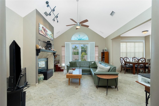 5219 Guava Ter, Port Charlotte, FL 33981 - living room with ceiling fan, a high end fireplace, and high vaulted ceiling