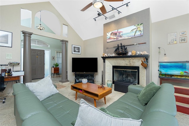 5219 Guava Ter, Port Charlotte, FL 33981 - living area featuring ornate columns, a ceiling fan, a high end fireplace, and high vaulted ceiling