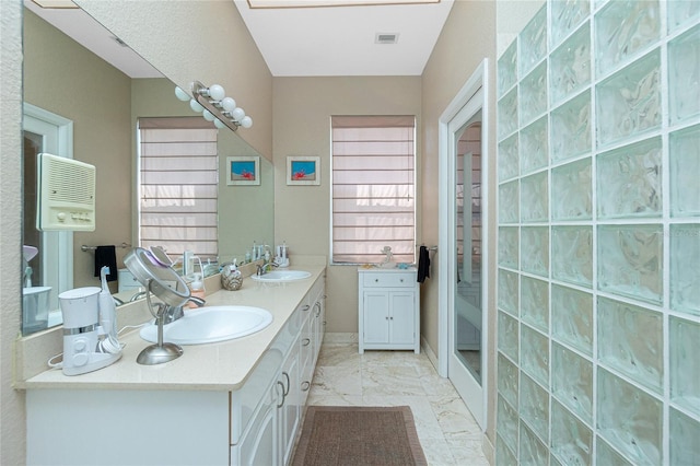 5219 Guava Ter, Port Charlotte, FL 33981 - bathroom with double vanity and marble look tile flooring