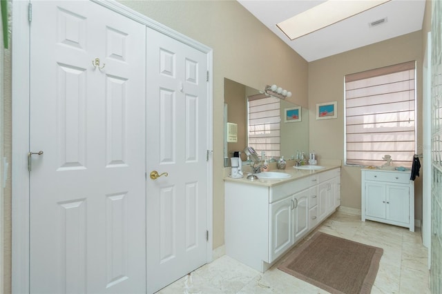 5219 Guava Ter, Port Charlotte, FL 33981 - full bathroom with double vanity and marble look tiles