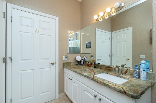 5219 Guava Ter, Port Charlotte, FL 33981 - bathroom with vanity and a textured wall