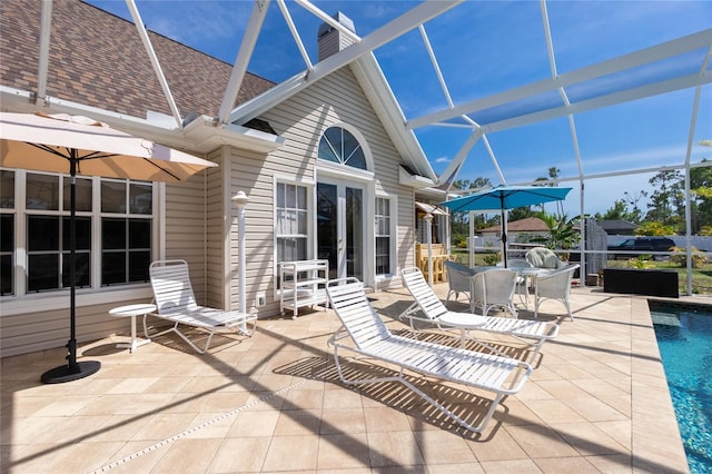 5219 Guava Ter, Port Charlotte, FL 33981 - view of patio / terrace with a lanai, french doors, and an outdoor pool