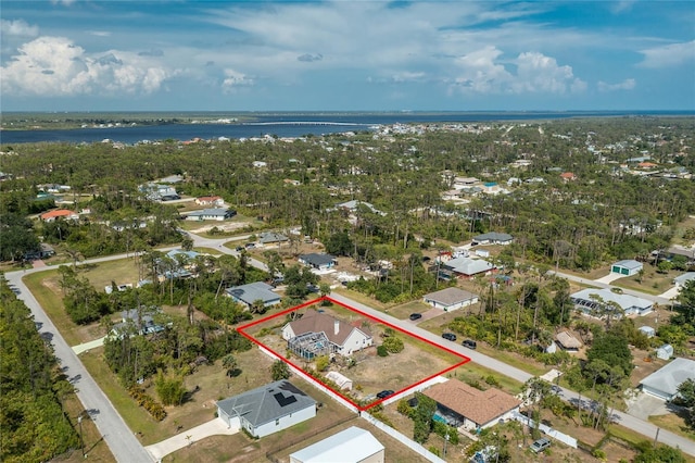 5219 Guava Ter, Port Charlotte, FL 33981 - aerial view of residential area with property parcel outlined and a nearby body of water
